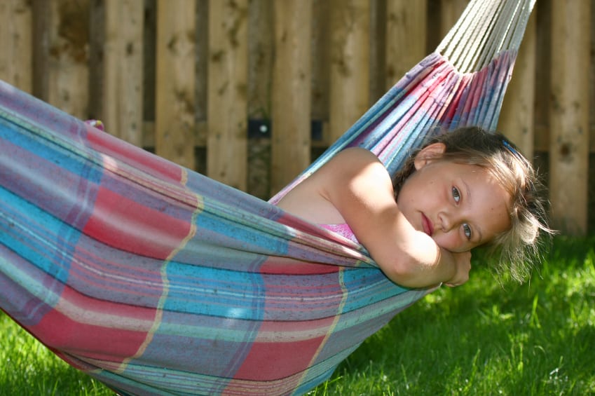 Little girl sleeping in hammock